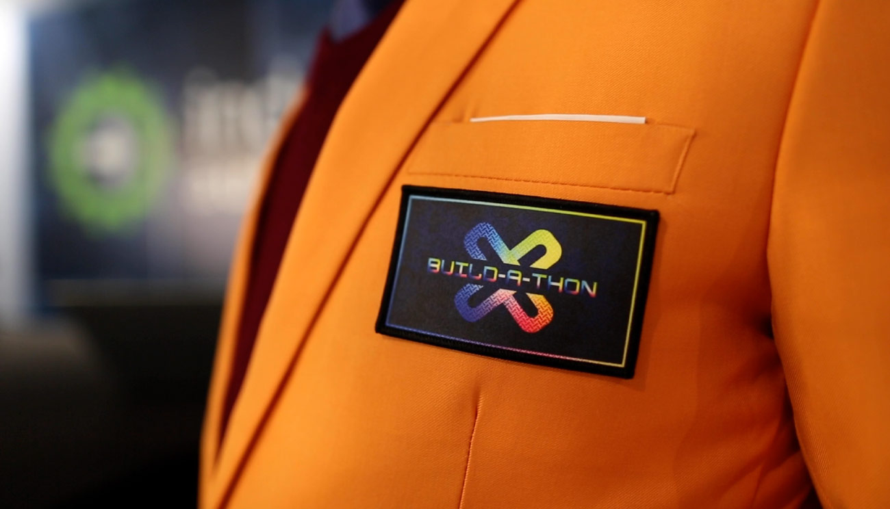 Build-a-Thon orange winner's jacket.